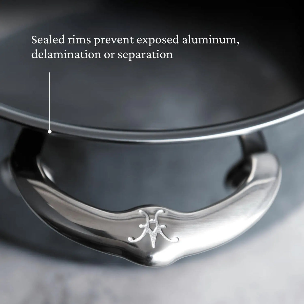 A close-up of a NanoBond 18-Piece Titanium Cookware Set pot shows its sealed rim and polished handle with engraved logo. Text notes the rim prevents exposed aluminum, delamination, or separation.