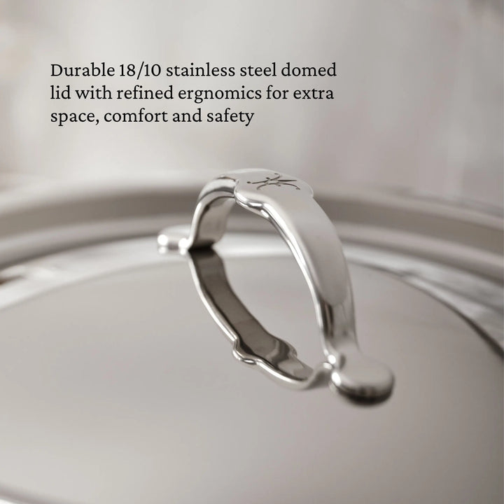 Close-up of TITUM® Fusion 12.5-Inch Nonstick Wok’s domed stainless steel lid with curved handle, showcasing its smooth, reflective surface. Durable and ergonomic, it offers extra space for comfort and safety in premium nonstick cookware.