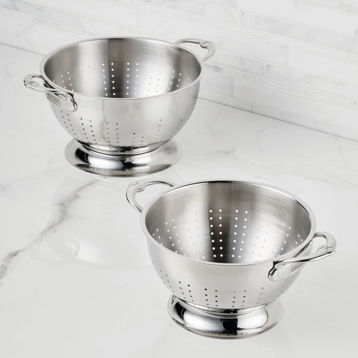The Hestan Provisions Stainless Steel Colander Set, 2-Piece, features ergonomic handles and sturdy bases for style and everyday practicality—ideal for rinsing or draining on your kitchen countertop.