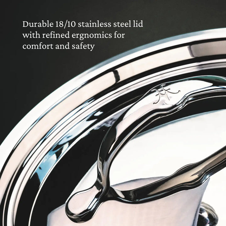 Close-up of a lid from the ProBond Professional Clad Stainless Steel Ultimate Set, 10-piece. The shiny, reflective lid features durable 18/10 stainless steel with refined ergonomics for comfort and safety.