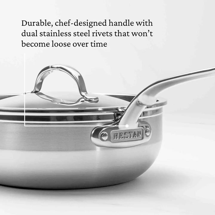 A ProBond Professional Clad Stainless Steel Essential Pan is shown, featuring a robust, chef-designed handle and a lid with matching handle. Dual stainless steel rivets ensure durability, while its tri-ply aluminum core guarantees even heat distribution.