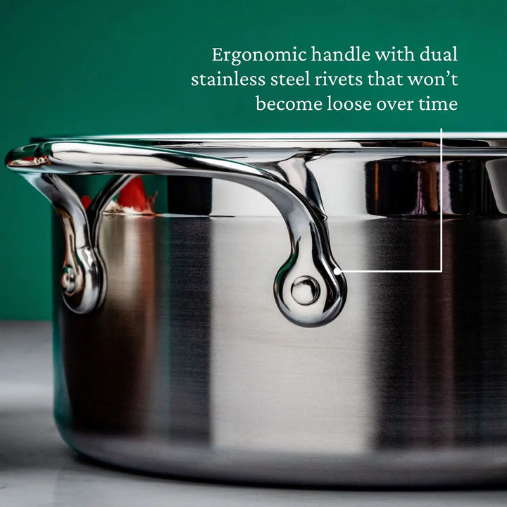 Close-up of ProBonds 3-Quart Professional Clad Stainless Steel Soup Pot showcasing its ergonomic handle secured with dual rivets that remain firm over time. The tri-ply construction boosts durability, set against a neutral background.