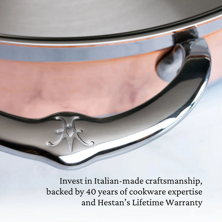 Close-up of a polished metal handle on CopperBond Copper Induction Ultimate Set, 10-Piece; engraved logo visible on copper pot. Text highlights Italian-made quality, 40 years of expertise, and a lifetime warranty.