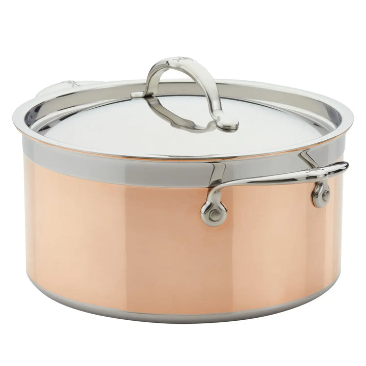 The CopperBond Copper Induction Stock Pot, 6-Quart, offers an elegant design with 5-ply construction for uniform heating. The pot is induction-compatible, featuring a copper-colored exterior, polished stainless steel rim and handles, and a stainless steel lid with a curved handle for easy lifting.