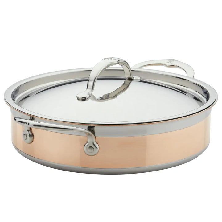 The CopperBond Copper Induction Sauteuse with Lid, 3.5-Quart, is sleek and modern with a shiny finish, featuring induction compatibility, two sturdy handles, and a snug-fitting lid with a central handle for efficient cooking.