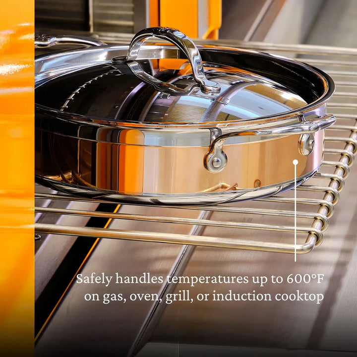 A CopperBond Copper Induction Sauteuse with Lid (3.5-Quart) sits on an oven rack, reflecting its surroundings. Text below reads: Safely handles temperatures up to 600°F on gas, oven, grill, or induction cooktop, highlighting its full induction compatibility.