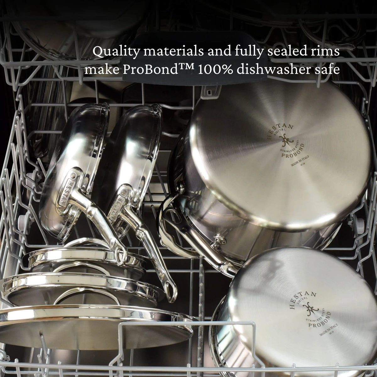 ProBonds 3.5-quart Professional Clad Stainless Steel TITUM® Nonstick Sauté Pan with Lid is arranged inside a dishwasher. The text at the top reads, Quality materials and fully sealed rims make ProBond™ 100% dishwasher safe.