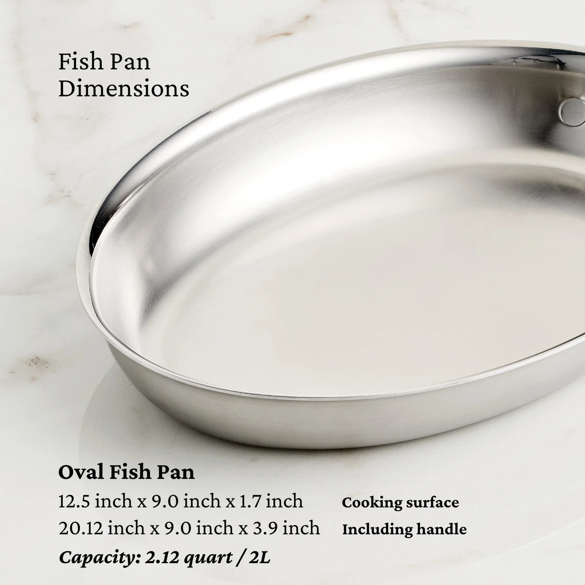 The Hestan Provisions Oval Fish Pan, made of stainless steel, sits on marble. It features a 12.5 x 9.0 x 1.7-inch cooking area and measures 20.12 x 9.0 x 3.9 inches with the handle, offering even heat distribution and a capacity of 2.12 quarts.