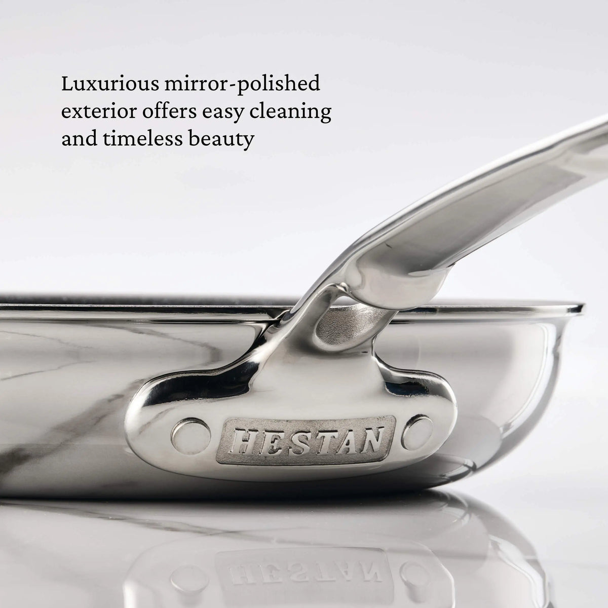 Close-up of the ProBond® Luxe™ Polished Clad Stainless Steel Ultimate Set, 10-Piece, highlighting its mirror-polished finish and Italian craftsmanship for timeless beauty.