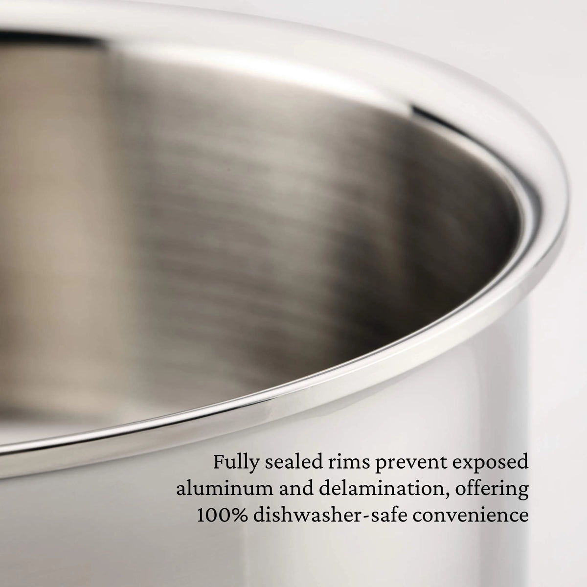 Close-up of a ProBond® Luxe™ Polished Clad Stainless Steel Ultimate Set, 10-Piece pot featuring smooth, fully sealed rims that prevent exposed aluminum and delamination for 100% dishwasher-safe professional cookware.