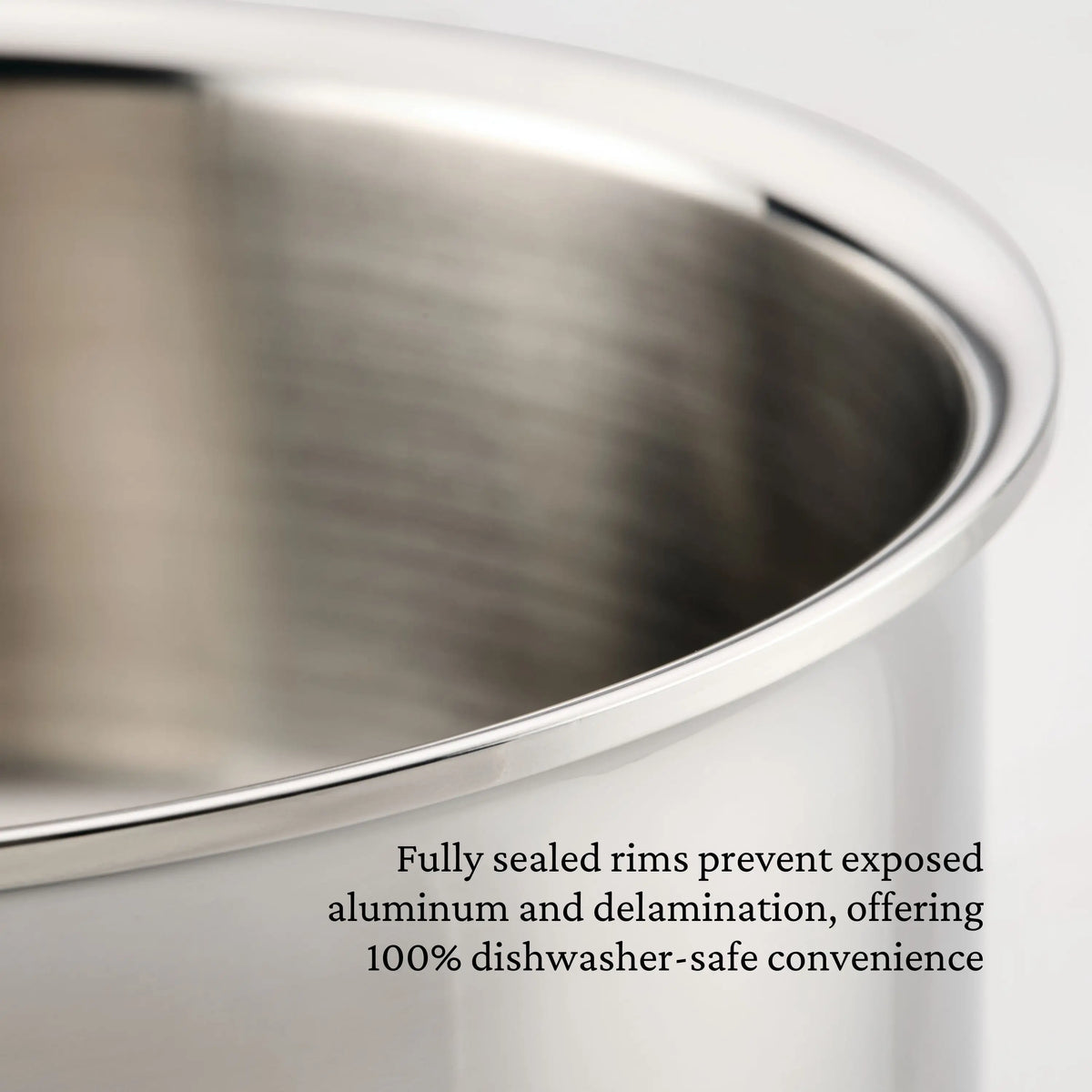 Close-up of a ProBond® Luxe™ Polished Clad Stainless Steel Saucepan with Lid. Text: Fully sealed rims prevent exposed aluminum and delamination, making these saucepans 100% dishwasher-safe.