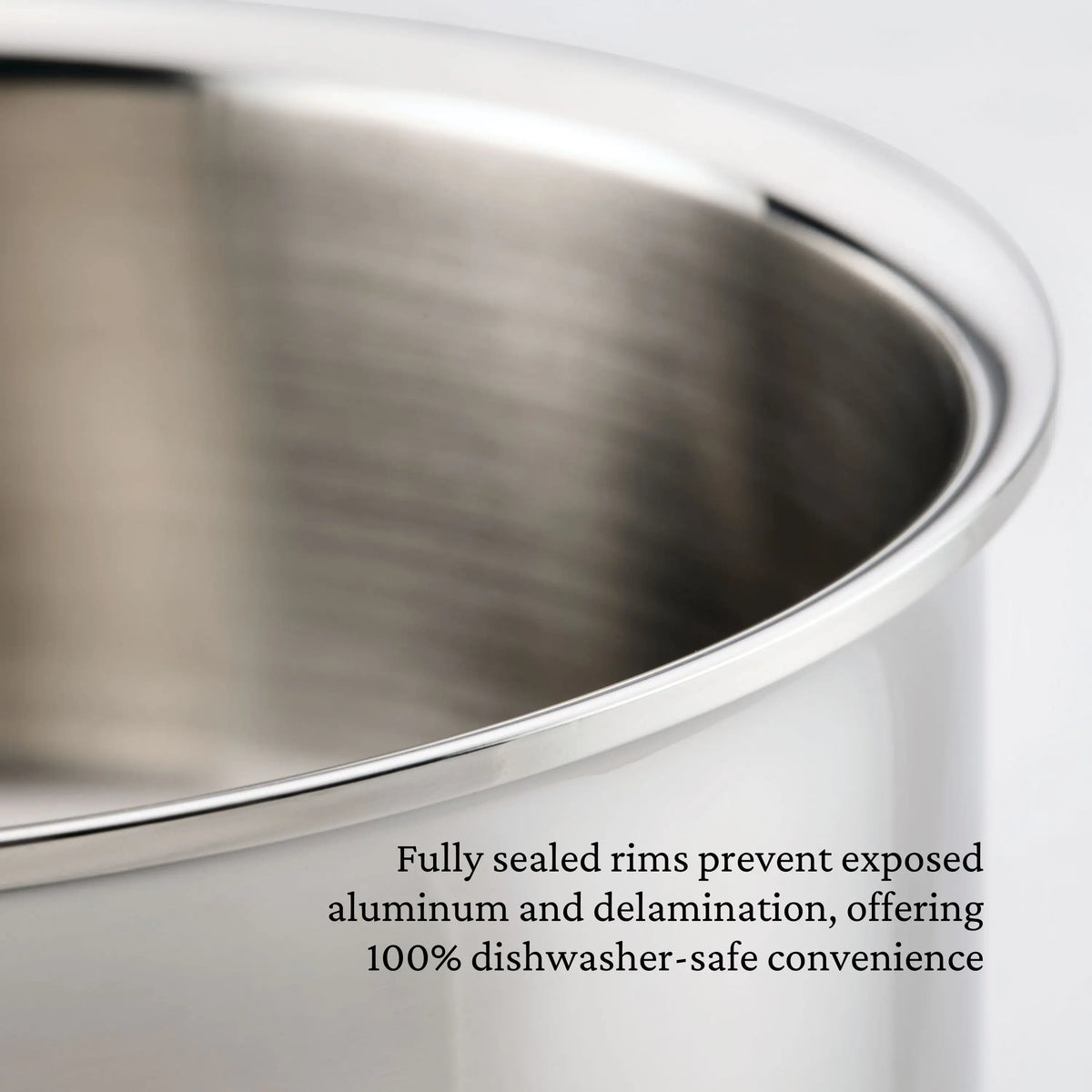 Close-up of the ProBond® Luxe™ Polished Clad Stainless Steel Braiser with Lid, 3.5-Quart. Italian craftsmanship ensures smooth, fully sealed rims—no exposed aluminum or delamination—making this professional cookware 100% dishwasher safe.