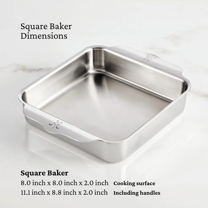 Displayed is a warp-resistant, stainless steel square baking pan with side handles from the Hestan Provisions OvenBond Tri-Ply 3-Piece Baking Set. It measures 8x8x2 for the cooking surface and 11.1x8.8x2 including handles.