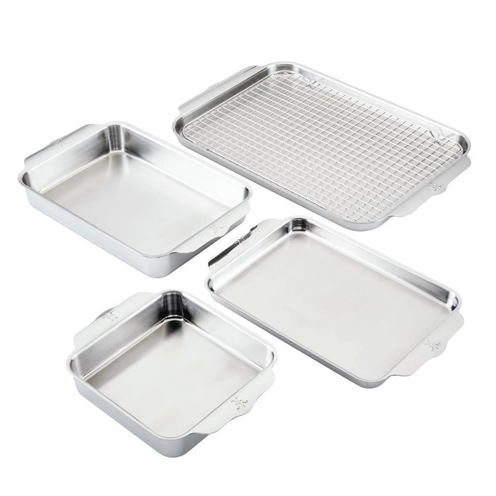 The Hestan Provisions OvenBond Tri-ply 5-Piece Set, includes two rectangular trays, a square baking pan, and a wire rack on a white background. All pieces are made from durable triple-bonded stainless steel for top performance.