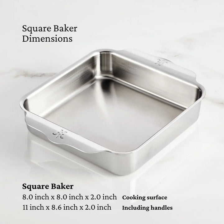 The OvenBond Tri-ply Set by Hestan Provisions features a square stainless steel baking pan with side handles. The dimensions are 8 x 8 x 2 inches for the cooking surface and 11 x 8.6 x 2 inches with handles, emphasizing its durable bakeware design on a white surface.