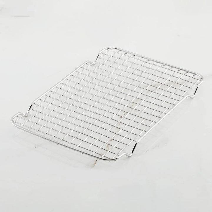 The Hestan OvenBond Tri-Ply Quarter Sheet Pans & Rack, 9-in x 12-in, features a rectangular rack with a grid pattern and four short legs, designed to fit perfectly in a quarter sheet pan.