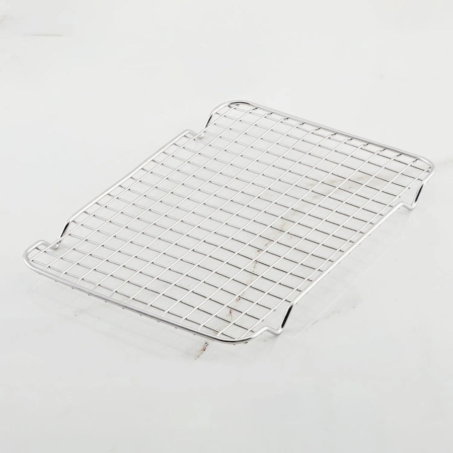 The Hestan OvenBond Tri-Ply Quarter Sheet Pans & Rack, 9-in x 12-in, features a rectangular rack with a grid pattern and four short legs, designed to fit perfectly in a quarter sheet pan.
