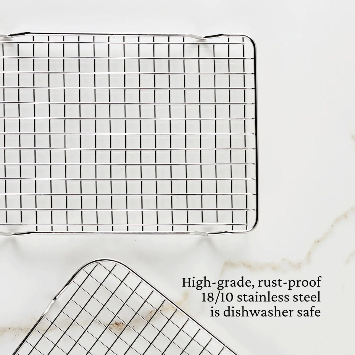 Two Hestan Provisions OvenBond Stainless Steel Quarter Sheet Pan Racks are on a light background, featuring a grid pattern. A caption reads: High-grade, rust-proof 18/10 stainless steel is dishwasher safe.