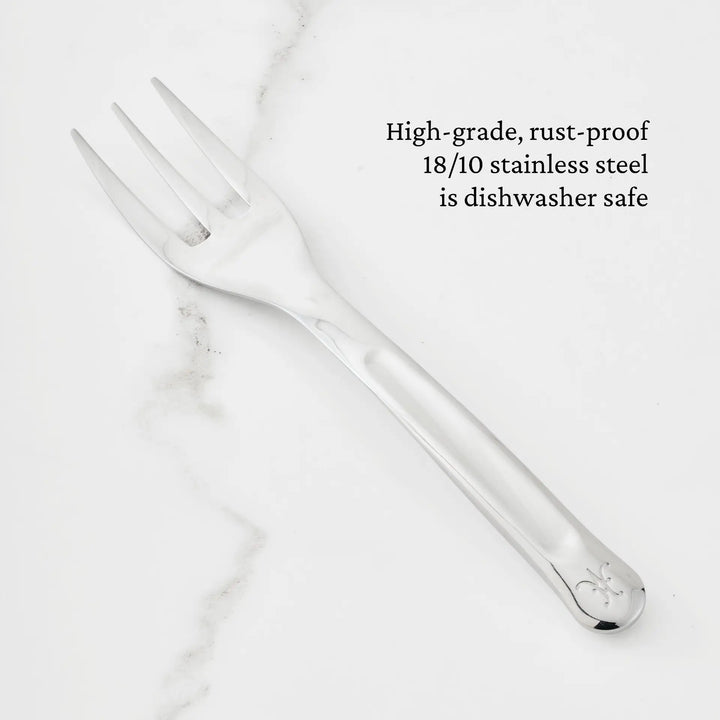 A 10.5-inch Stainless Steel Serving Fork from Hestan Provisions is displayed on a white marble surface. The text highlights that this fork, part of the Hestan Provisions Serving Tools collection, is crafted from high-grade, rust-proof 18/10 stainless steel and is dishwasher safe—making it a reliable choice among chef’s tools.