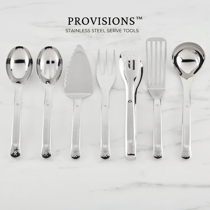 Seven stainless steel serving utensils—including the Hestan Provisions 10.5-inch Stainless Steel Pie & Cake Server—are arranged in a row on a white marble surface. Above them, the text reads: Hestan Provisions Serve Tools. These serving tools feature matching decorative handles, making them perfect for any chef’s kitchen collection.