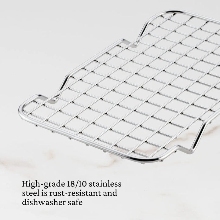 The Hestan Provisions OvenBond Tri-ply Mini Eighth Sheet Pan with Rack is a stainless steel wire rack on a white background, ideal as an eighth sheet pan accessory. It features a grid pattern with a raised edge and High-grade 18/10 stainless steel is rust-resistant and dishwasher safe text.