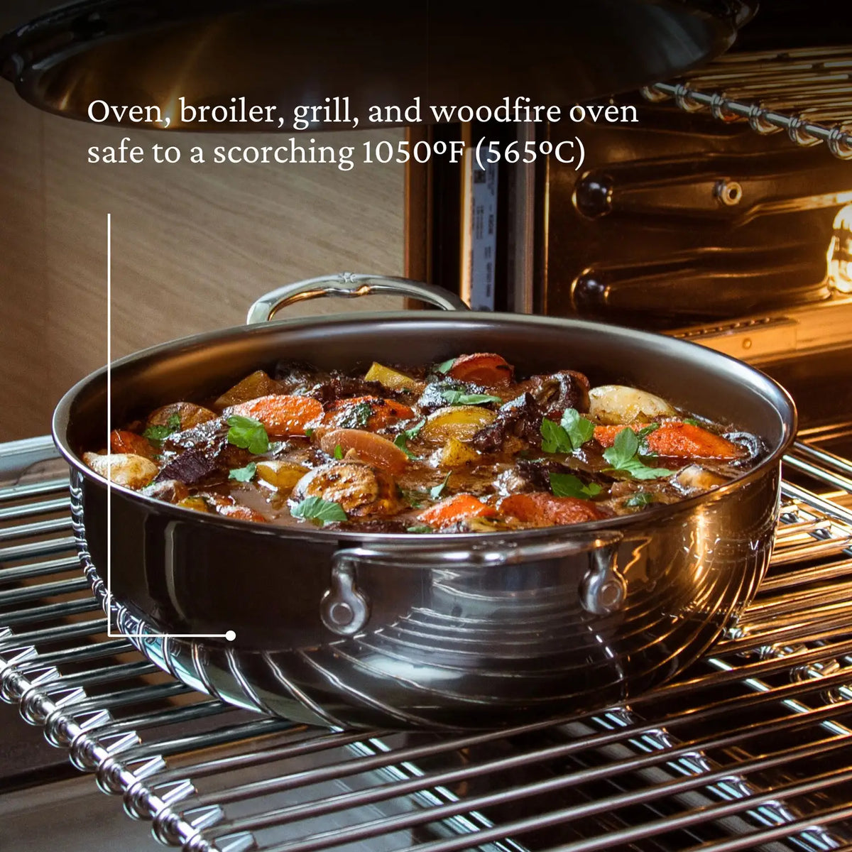 A NanoBond Titanium Dutch Oven with a stew of meat, carrots, and potatoes garnished with parsley. Text reads, NanoBond safe for broiler, grill, and woodfire cooking up to 1050°F (565°C).
