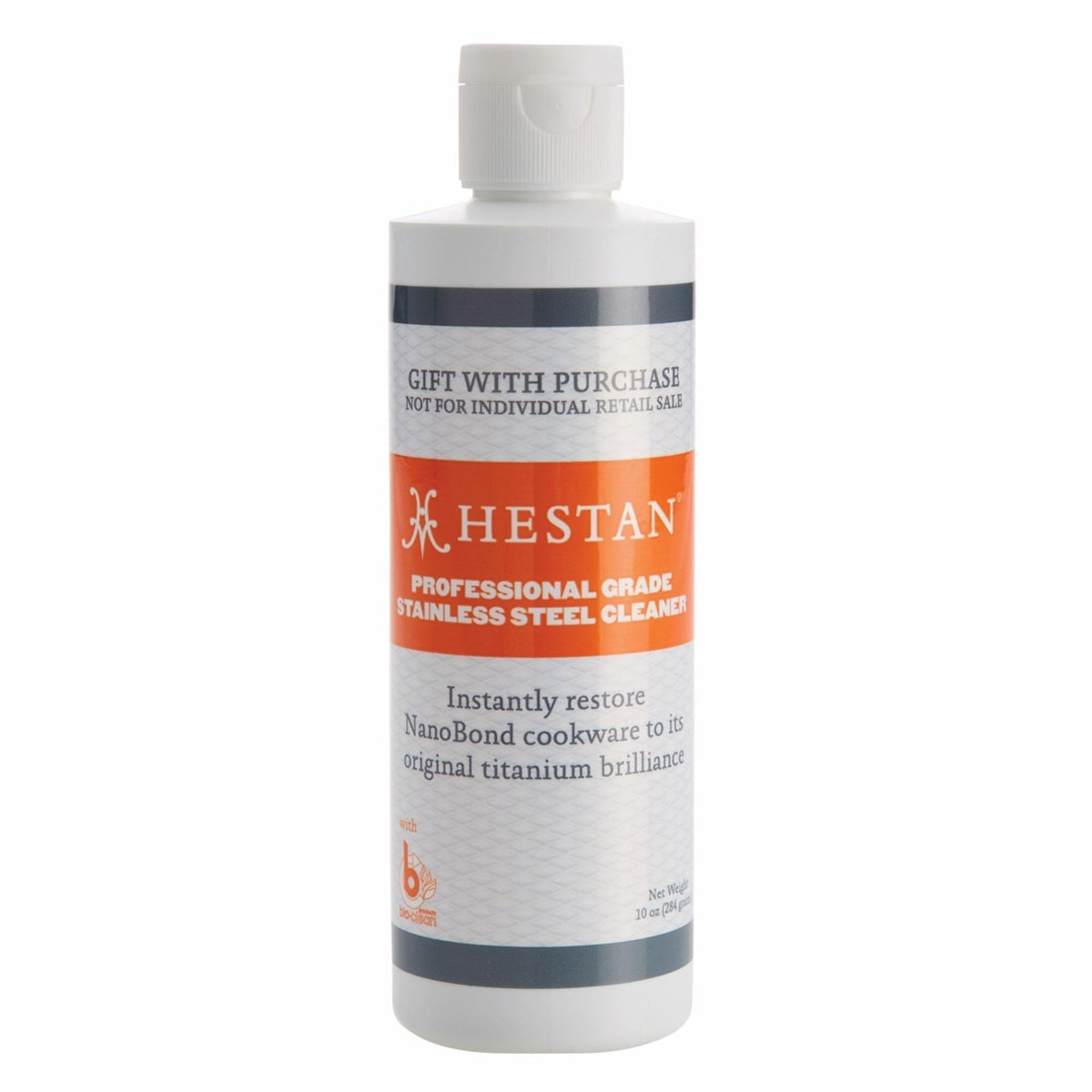 A 12-ounce white bottle of Hestan NanoBond® Professional Grade Cleaner with an orange label, highlighting its ability to restore NanoBond cookware, is available as a gift with purchase by Accessories and not for individual retail sale.
