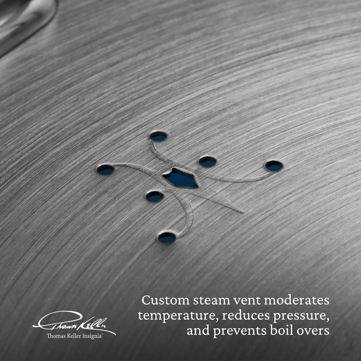 The Thomas Keller Commercial Clad Stainless Steel 11-Piece Cookware Set features lids with custom steam vents of multiple small holes and engraved lines, helping moderate temperature and reduce pressure for added safety and control in the kitchen.