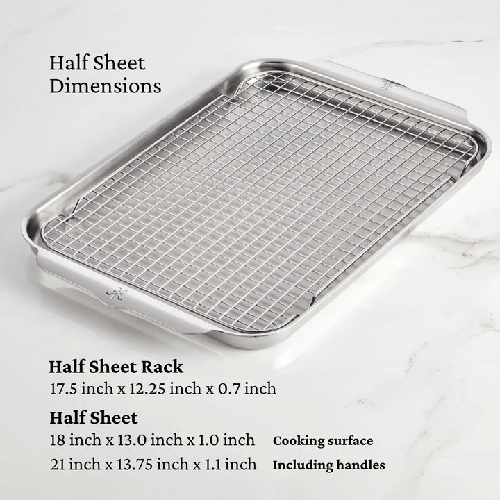 A ProBond Professional Clad Performance set half sheet pan and grid rack rest on marble, echoing Hestans quality. Dimensions are 17.5x12.25x0.7 inches for the rack and 18x13x1 inches for the sheet, similar to precision-crafted tri-ply aluminum core cookware tools.