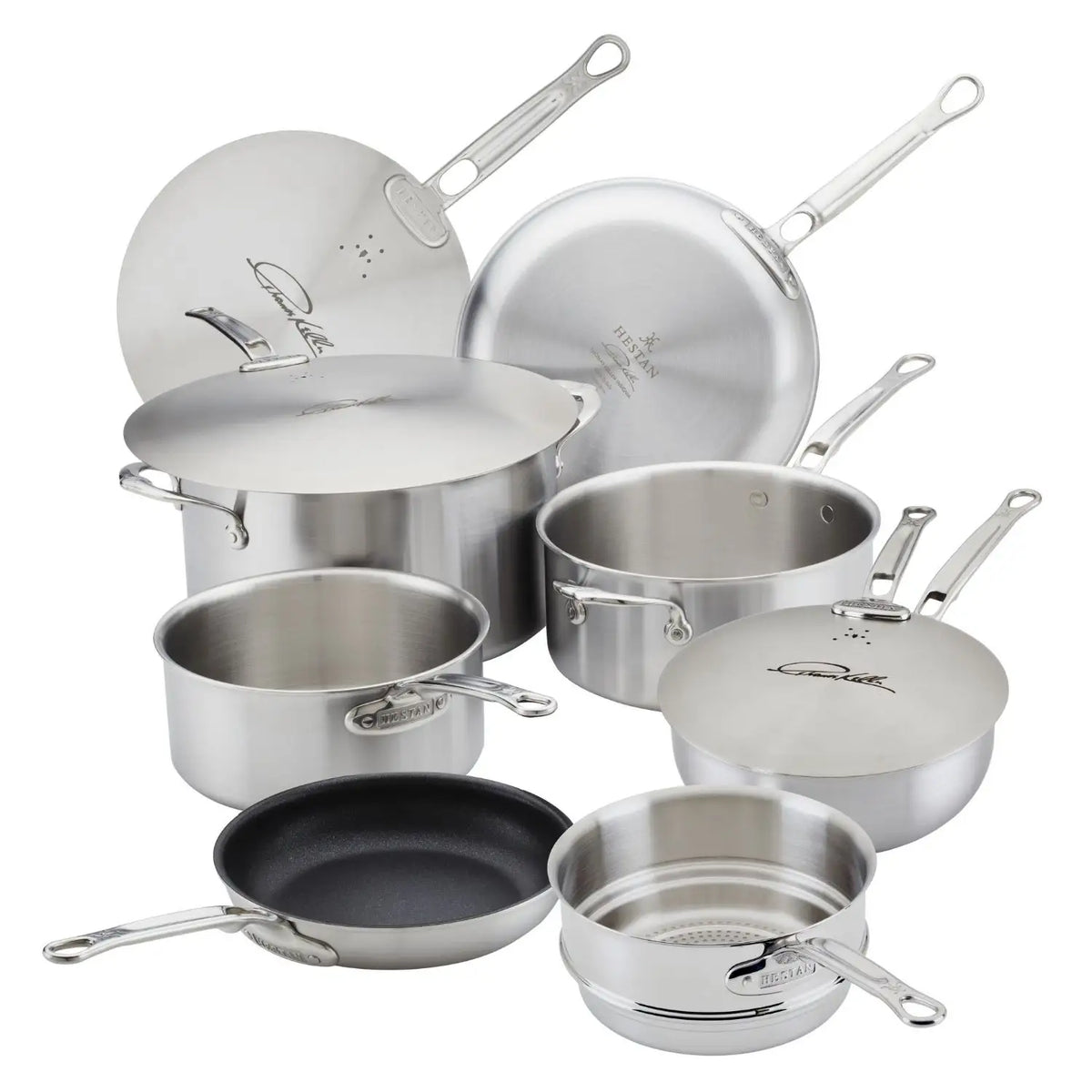 The Thomas Keller Commercial Clad Stainless Steel 10-Piece Cookware Set, featuring frying pans, saucepans with lids, a sauté pan, stock pot, and steamer insert with metal handles, is arranged on a white surface for versatile kitchen performance.