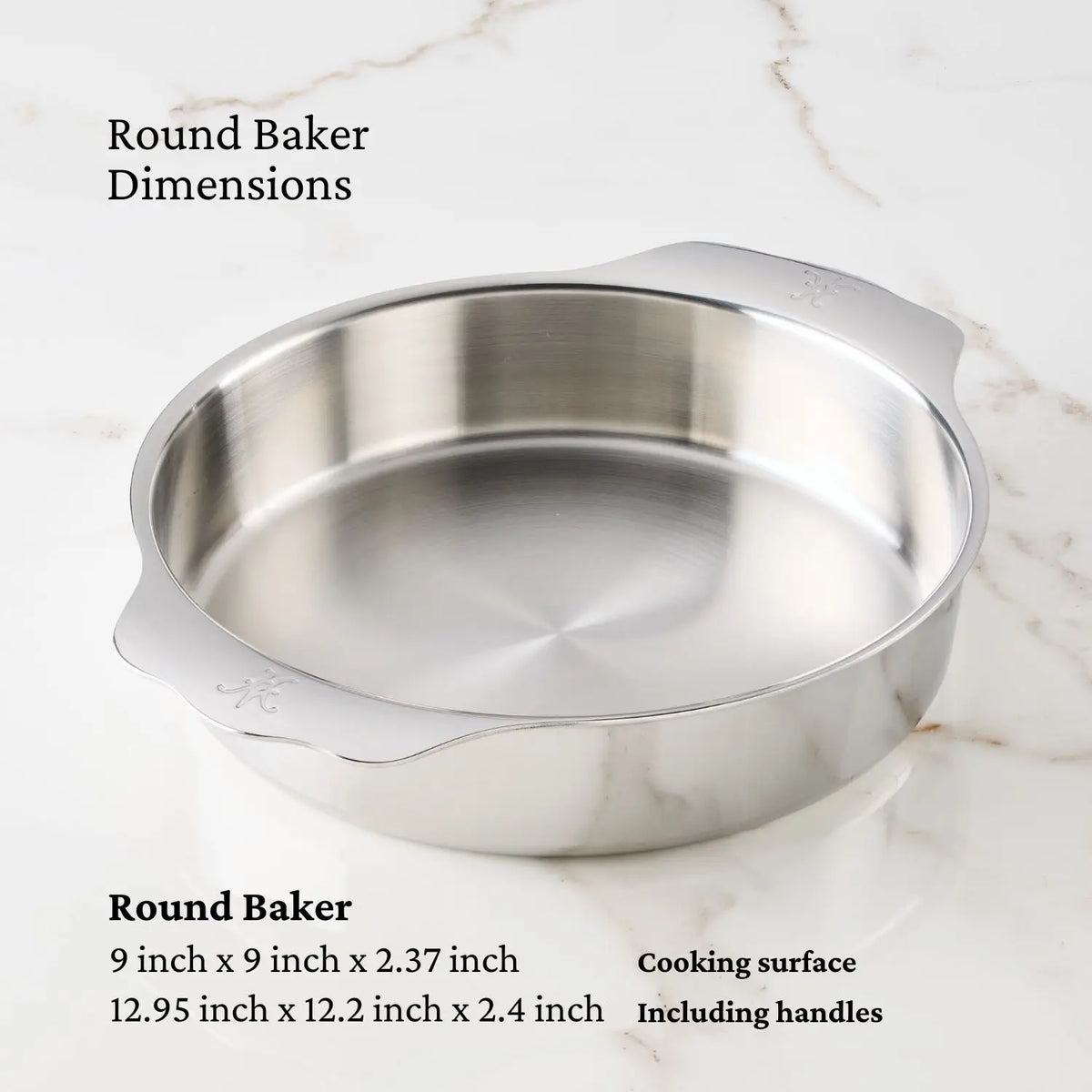 The Hestan Provisions OvenBond Tri-ply Epicurean Stainless Steel baking dish elegantly rests on a marble surface, measuring 9 x 9 x 2.37 inches and 12.95 x 12.2 x 2.4 inches including handles, designed for enhanced cooking efficiency.