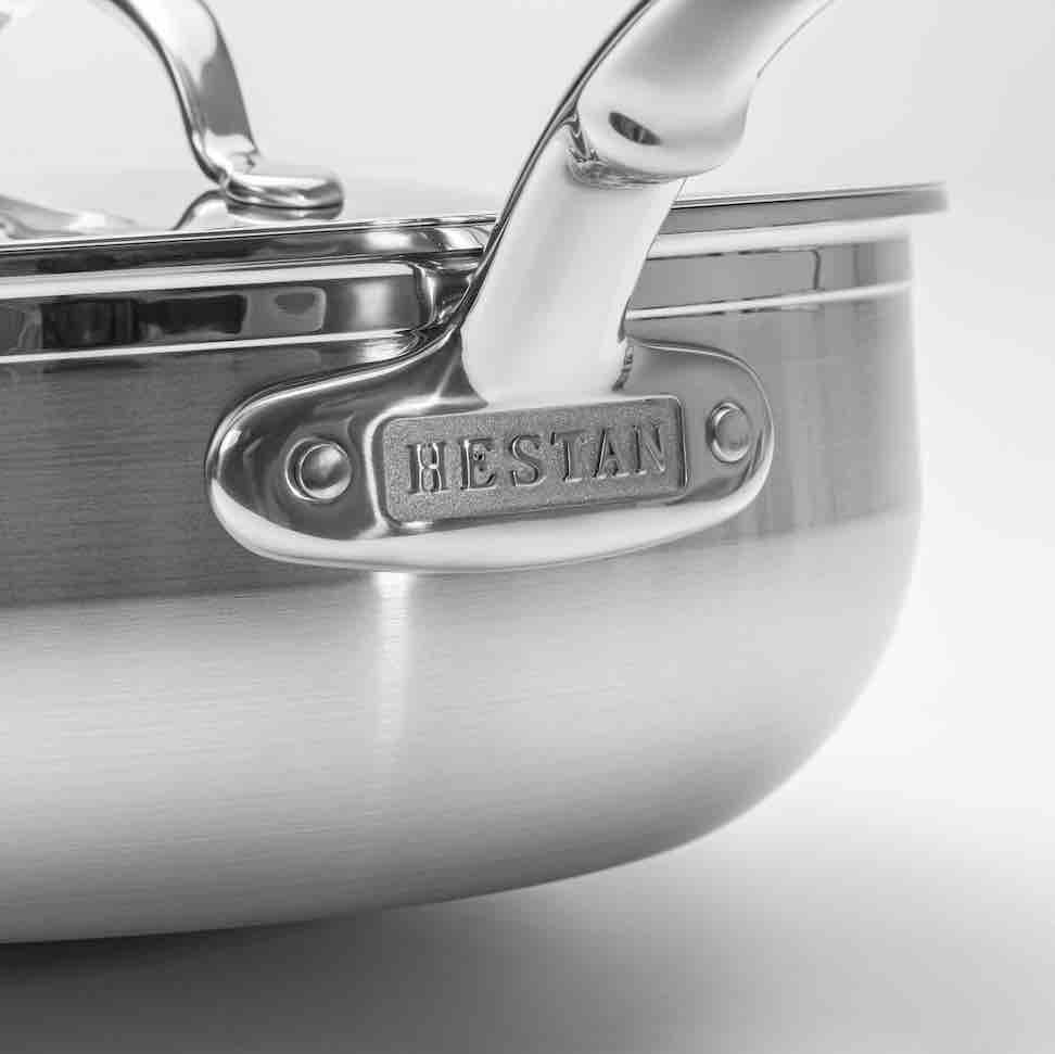 Close-up of a tri-ply stainless steel saucepan with a shiny handle, featuring ProBond embossed on the handles base. The image highlights its polished finish and robust construction, making it a standout piece in the Professional Clad Stainless Steel Induction 4pc Cookware Set.