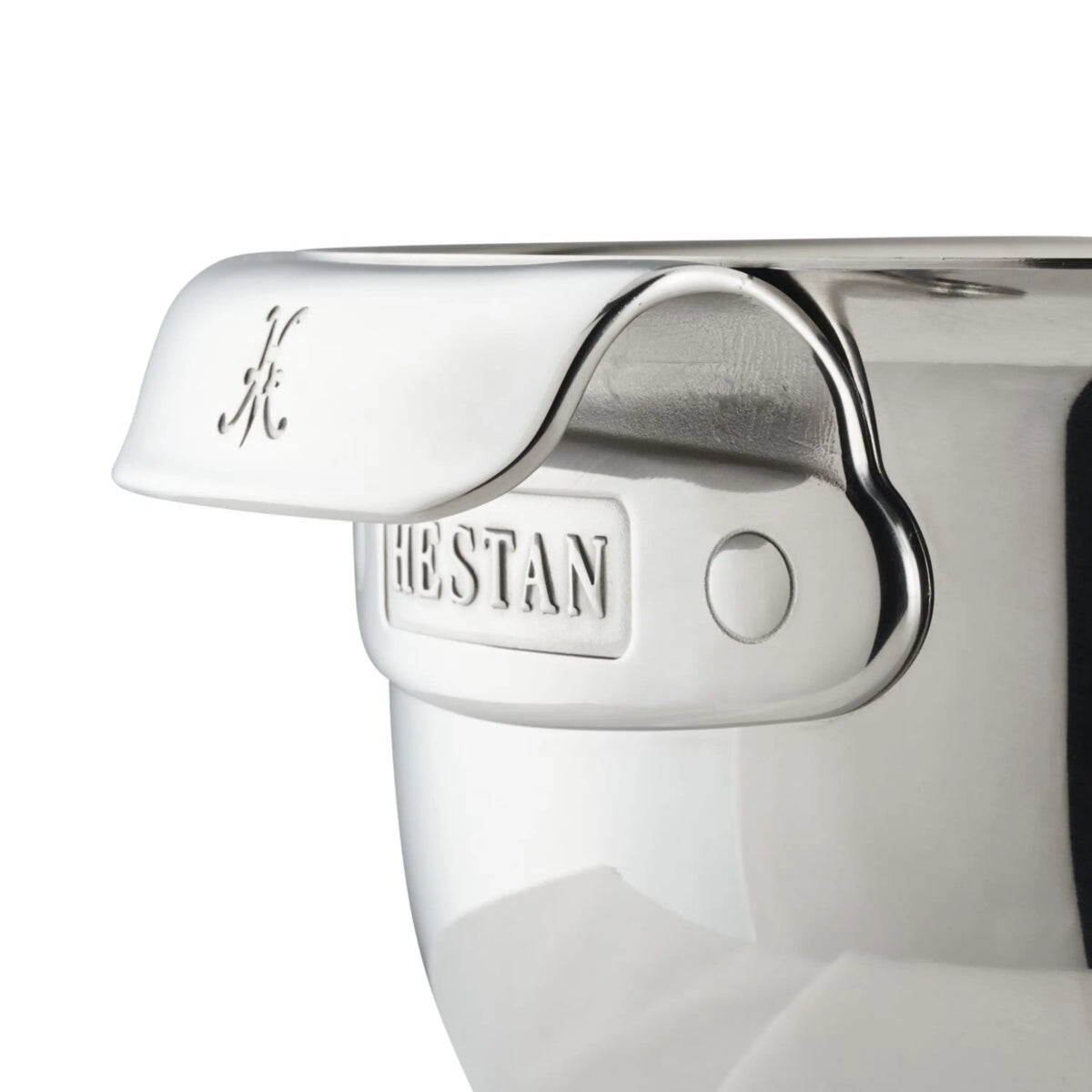 Close-up of the Hestan Provisions Stainless Steel Mixing Bowl, 7-Quart, highlighting its ergonomic handle with the Hestan name engraved and a small H at the end. The reflective, smooth finish enhances its premium look.