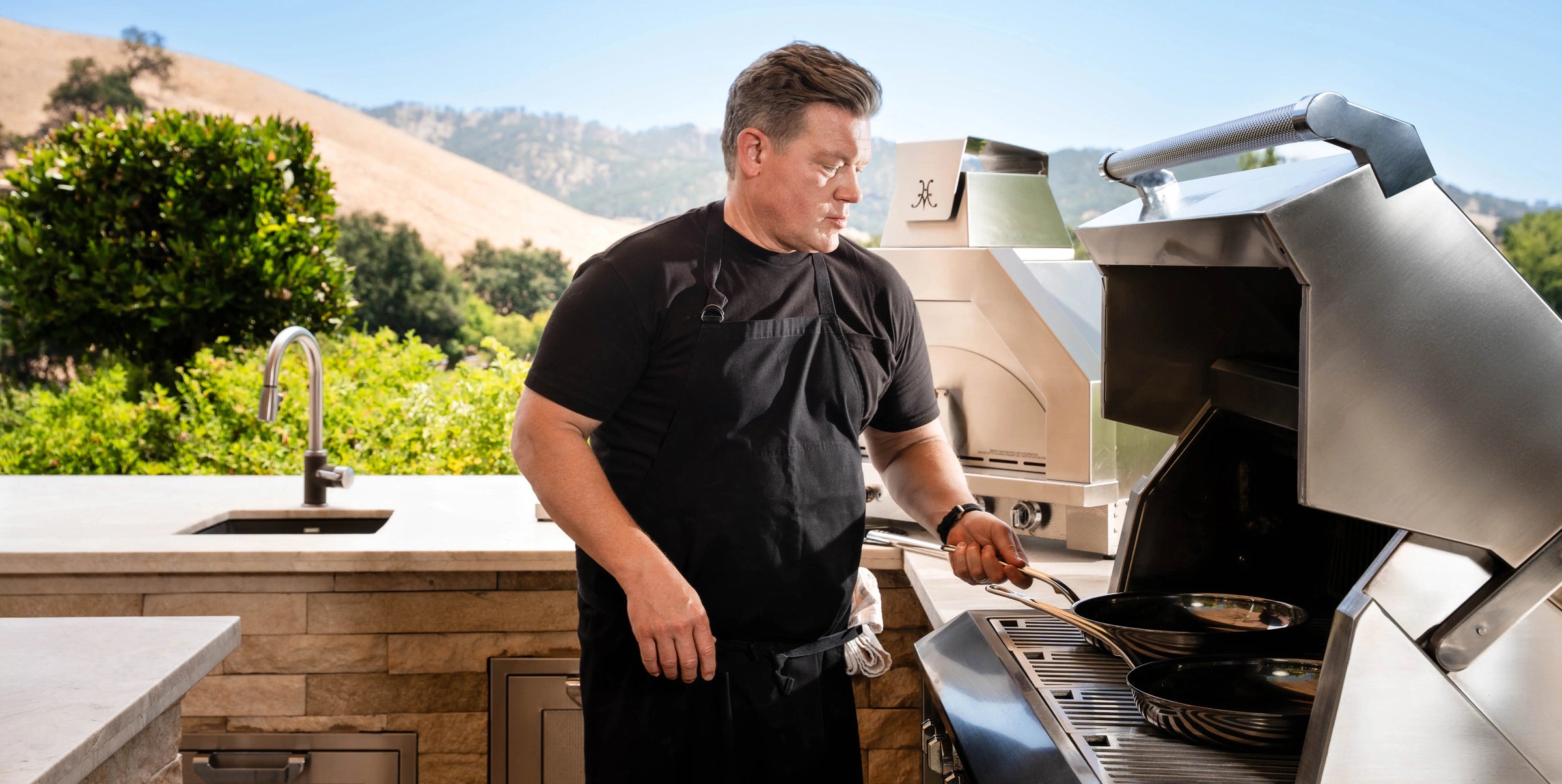 Chef Using Hestan Fry Pans on an Outdoor Grill
