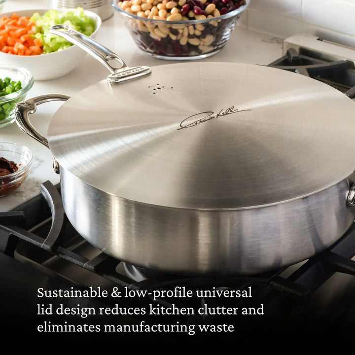 A Thomas Keller Commercial Clad Stainless Steel 11-Piece Cookware Set pot sits on the stove among bowls of chopped vegetables and beans, featuring a sustainable, low-profile lid to help reduce kitchen clutter and waste.