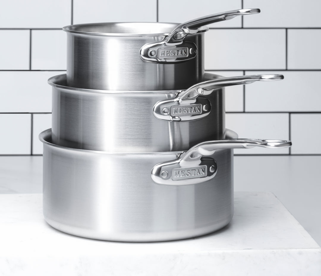 https://hestanculinary.com/cdn/shop/products/Insignia_stacked_saucepots_31019_31018_31017.jpg?v=1676474598&width=1080